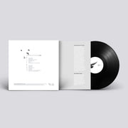 A black vinyl record with a matching monochrome gatefold sleeve, featuring a clean and modern design.