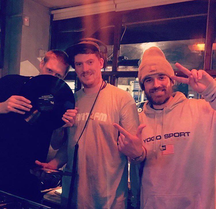  A group photo featuring DJs and producers, including members of the Village Live Records roster, at an event.