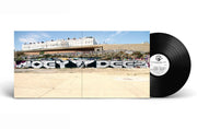 Joey Deez vinyl album cover featuring a wide-shot photograph of a graffiti mural spelling "Joey Deez" on a concrete wall, with a black vinyl record partially visible. The artwork reflects urban hip-hop aesthetics and underground culture.