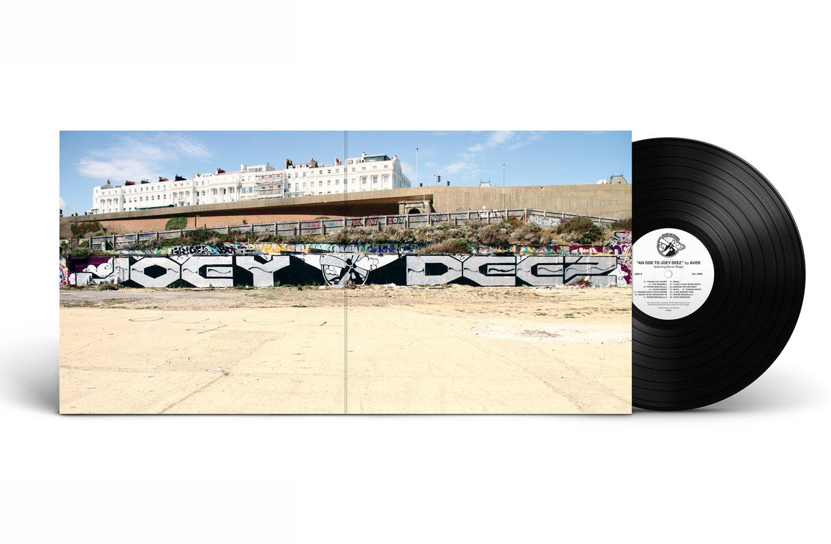 Joey Deez vinyl album cover featuring a wide-shot photograph of a graffiti mural spelling "Joey Deez" on a concrete wall, with a black vinyl record partially visible. The artwork reflects urban hip-hop aesthetics and underground culture.