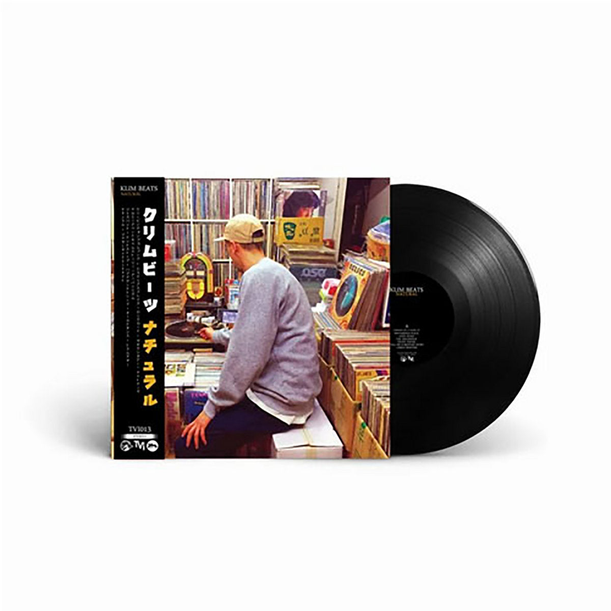 Black vinyl edition of Klim Beats' Natural LP, featuring Japanese-style obi strip and a photo of the artist digging for records in a vibrant shop setting