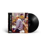 Black vinyl edition of Klim Beats' Natural LP, featuring Japanese-style obi strip and a photo of the artist digging for records in a vibrant shop setting