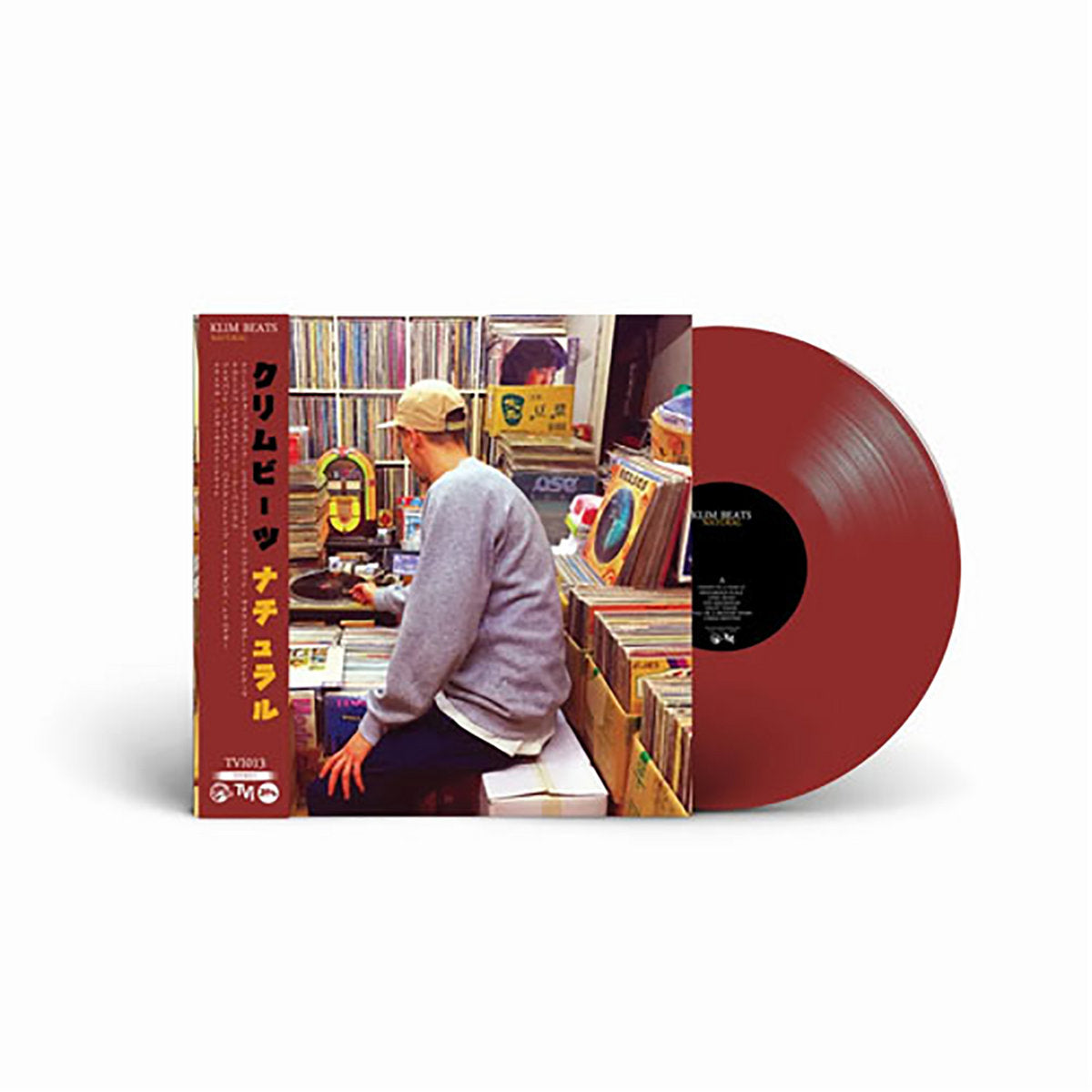 Red vinyl edition of Klim Beats' Natural LP, featuring Japanese-style obi strip and a photo of the artist digging for records in a vibrant shop setting